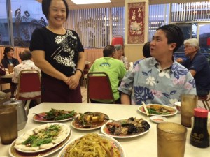 Duk Kee's owner Cammy talking food with Jackie's son, Ryan Oda, a realtor and Iolani graduate